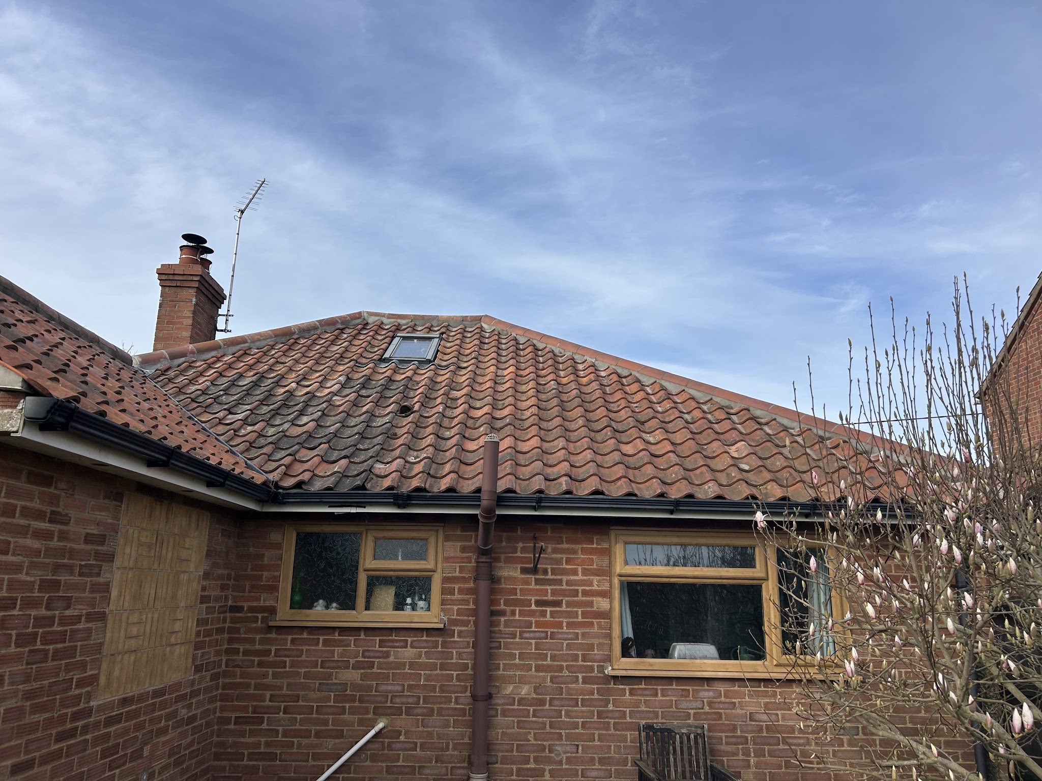 A bungalow with a tiled hipped roof
